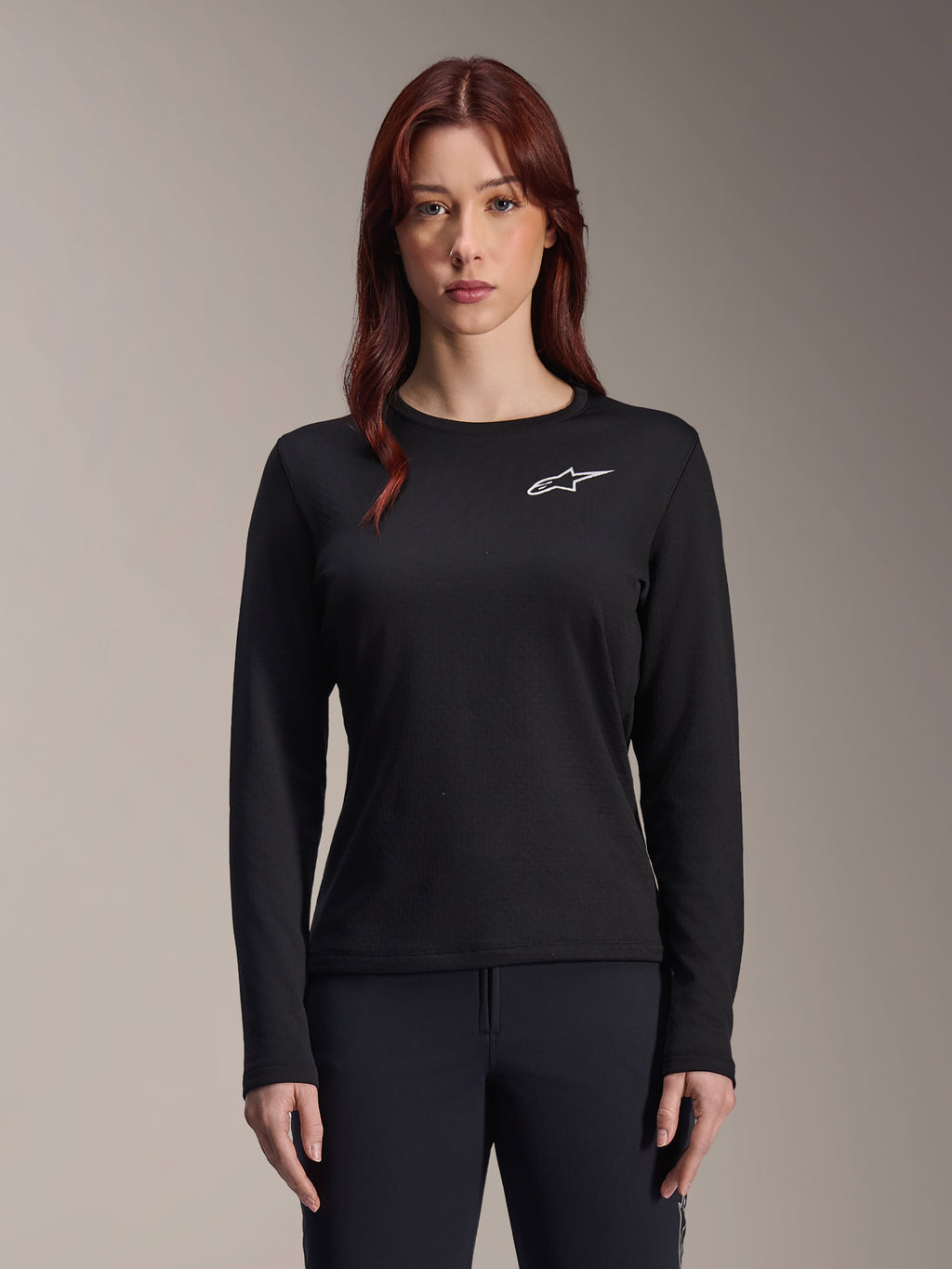 Alpinestars Stella A-Dura Thermal Jersey, Women's Long-Sleeve MTB Jersey, Black with white star logo on the chest, lightweight insulated fabric for cold weather cycling, designed for layering and trail comfort