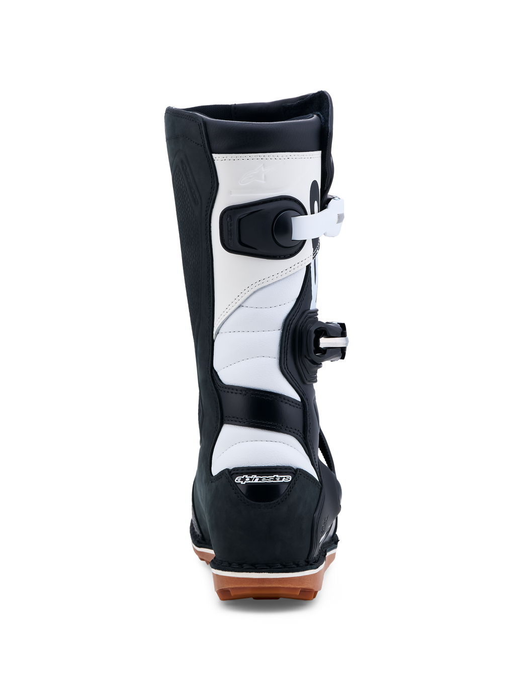 Alpinestars Tech-T, botas de moto para trial, pretas e brancas, certificadas CE, construção em couro com sola de borracha aderente, vista traseira.