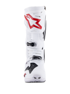 Botas Alpinestars Tech 10 Supervented, branco e vermelho brilhante, vista frontal mostrando painéis perfurados ventilados, logótipo grande de estrela vermelha na caneleira, fivelas prateadas ajustáveis e design de motocross de alta performance.