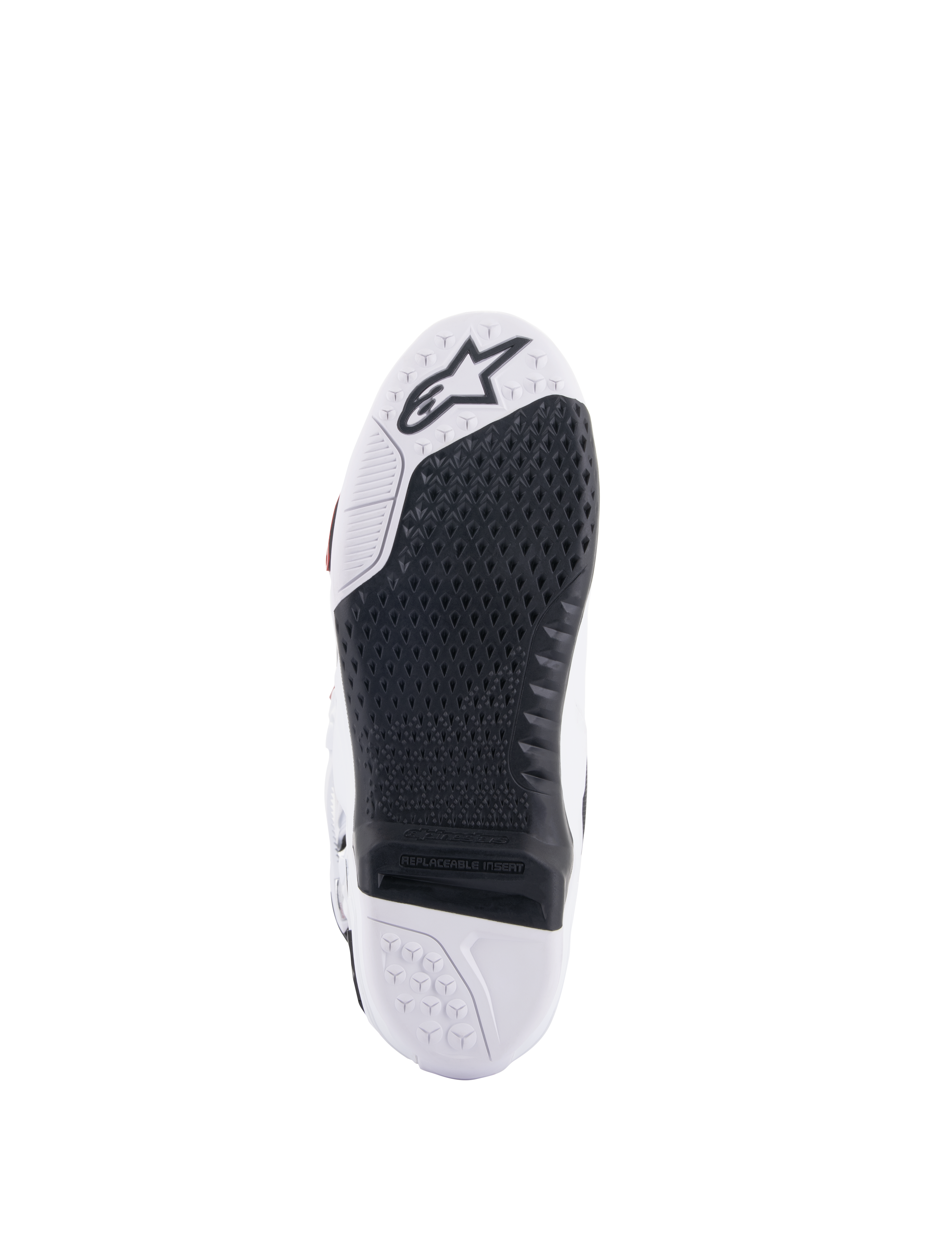 Botas Alpinestars Tech 10 Supervented, vista da sola branca e preta, design de aderência em favo de mel estendido, inserção central preta substituível, biqueira branca com logótipo de estrela Alpinestars, otimizada para controlo nos apoios de pés de motocross