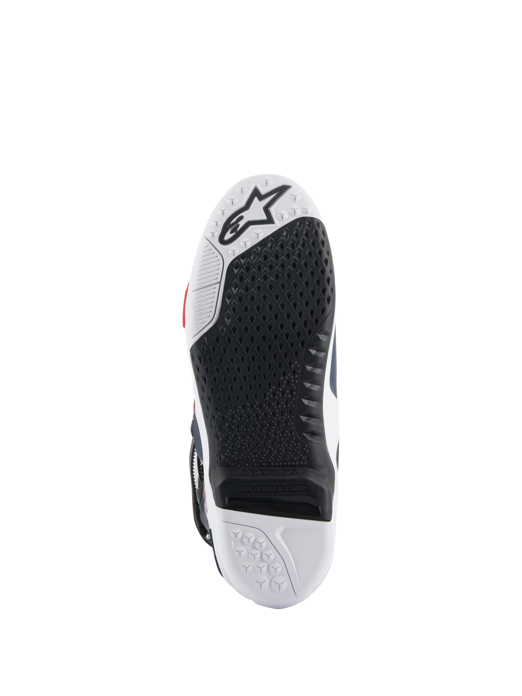 Sola das botas Alpinestars Tech 10 Supervented, vista inferior, design de composto duplo em preto e branco, textura de aderência em favo de mel, inserção central substituível, logótipo Alpinestars em relevo, otimizada para o desempenho nos apoios de pés de motocross