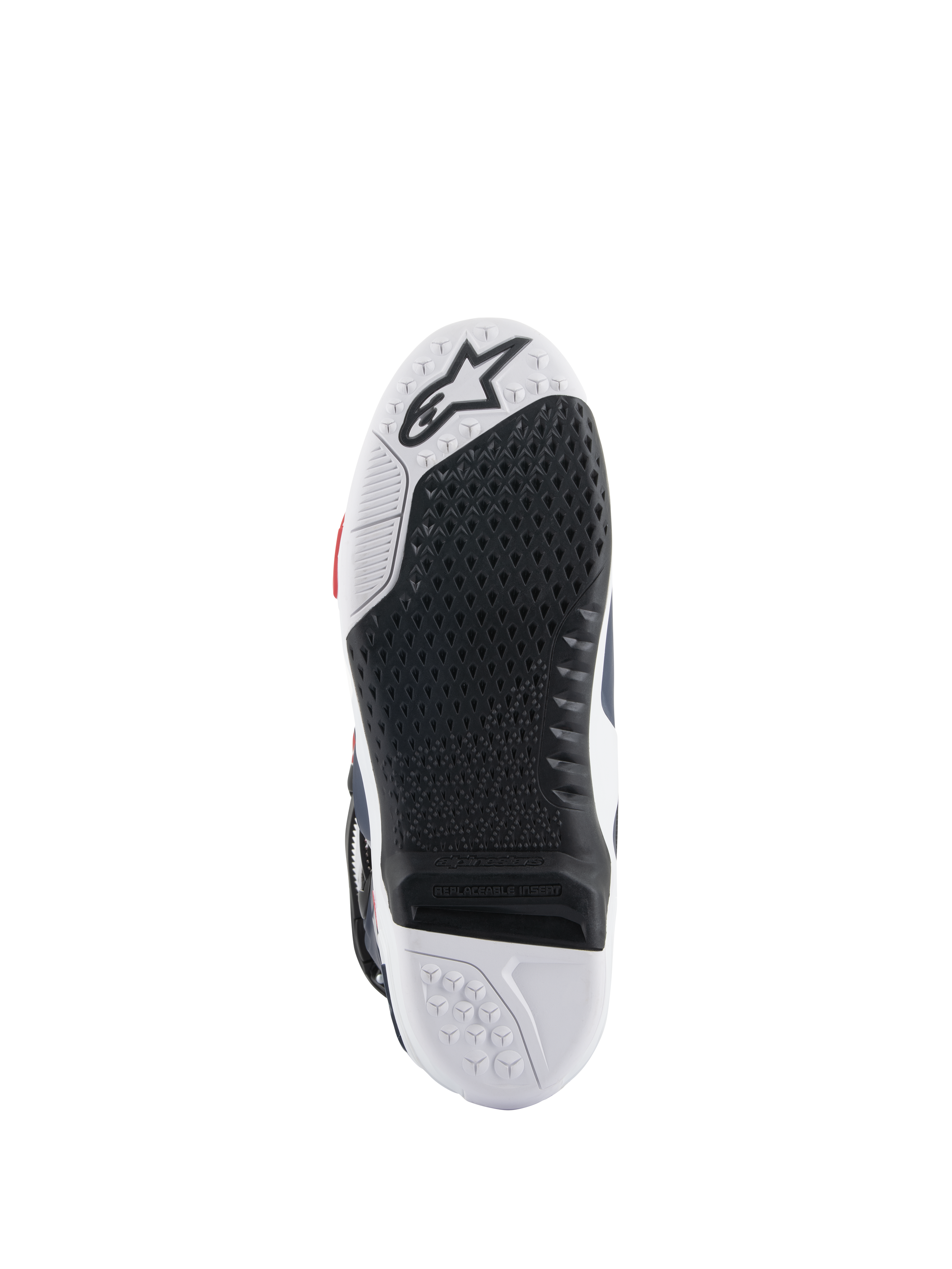 Sola das botas Alpinestars Tech 10 Supervented, vista inferior, design de composto duplo em preto e branco, textura de aderência em favo de mel, inserção central substituível, logótipo Alpinestars em relevo, otimizada para o desempenho nos apoios de pés de motocross