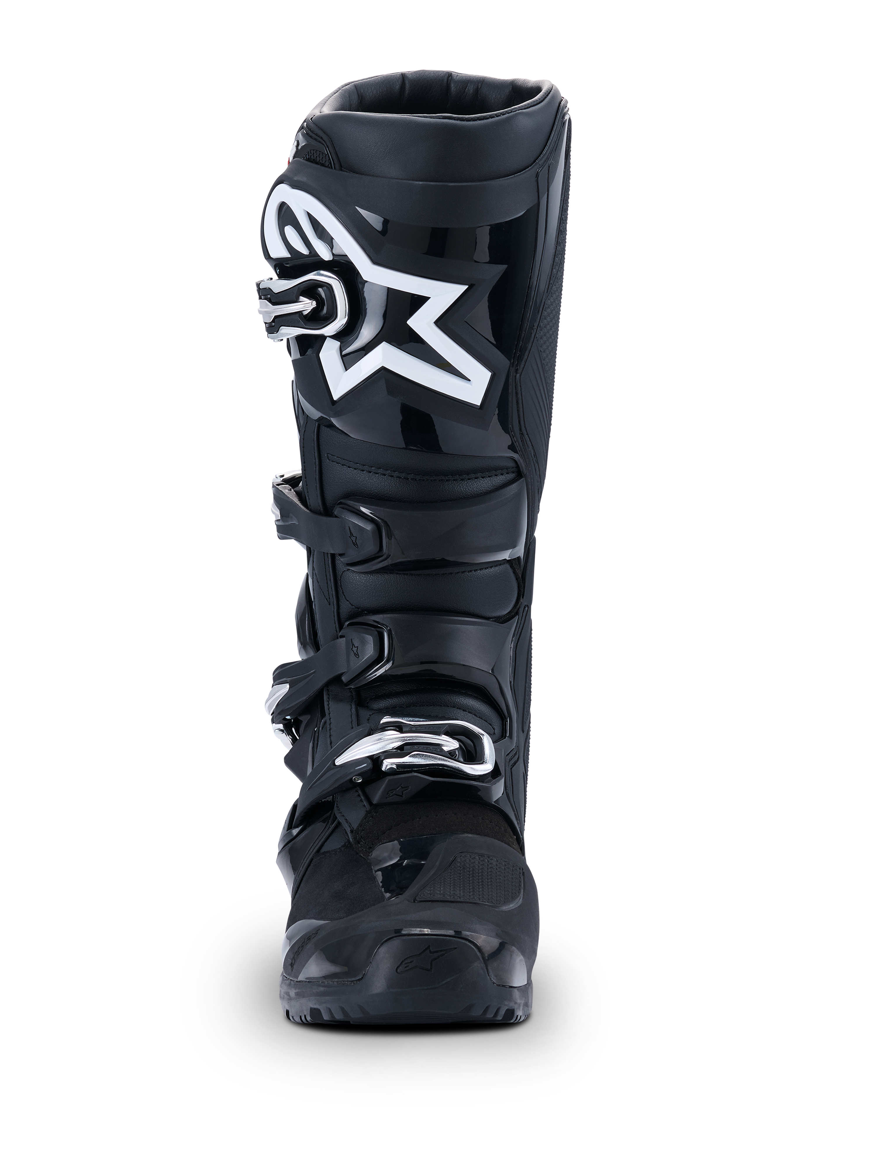 Botas Alpinestars 2026 Tech 7 Enduro Drystar®, botas de motocross pretas, vista frontal, com um sistema de fecho durável de quatro fivelas e logótipo de estrela branco proeminente na zona da canela, concebidas para performance em todo-o-terreno e enduro