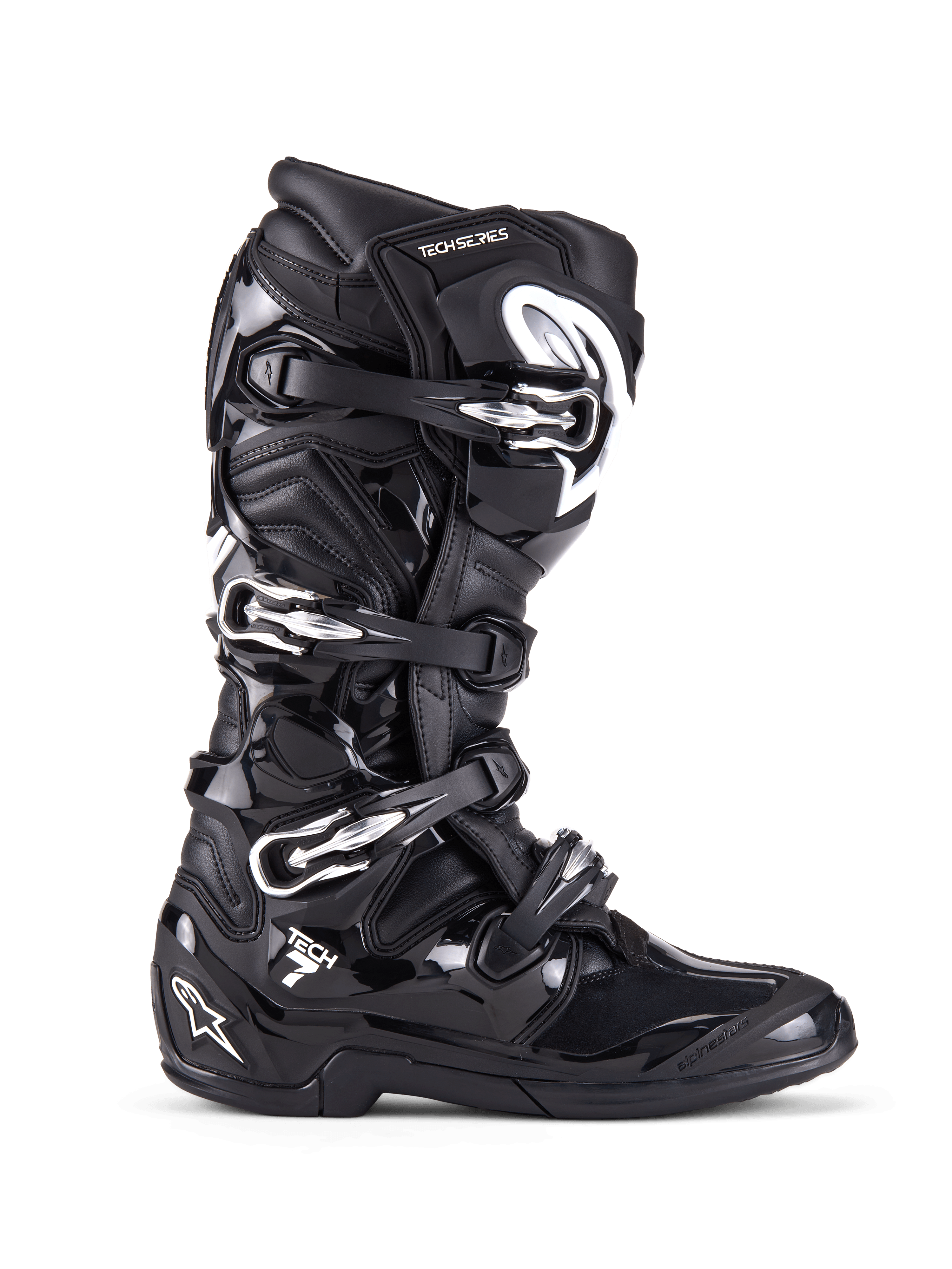 Botas Alpinestars Tech 7, botas de motocross off-road, pretas com fivelas prateadas e detalhes brancos, vista de perfil lateral com quatro fivelas de alumínio de libertação rápida, concha de TPU durável e painéis texturizados para proteção off-road
