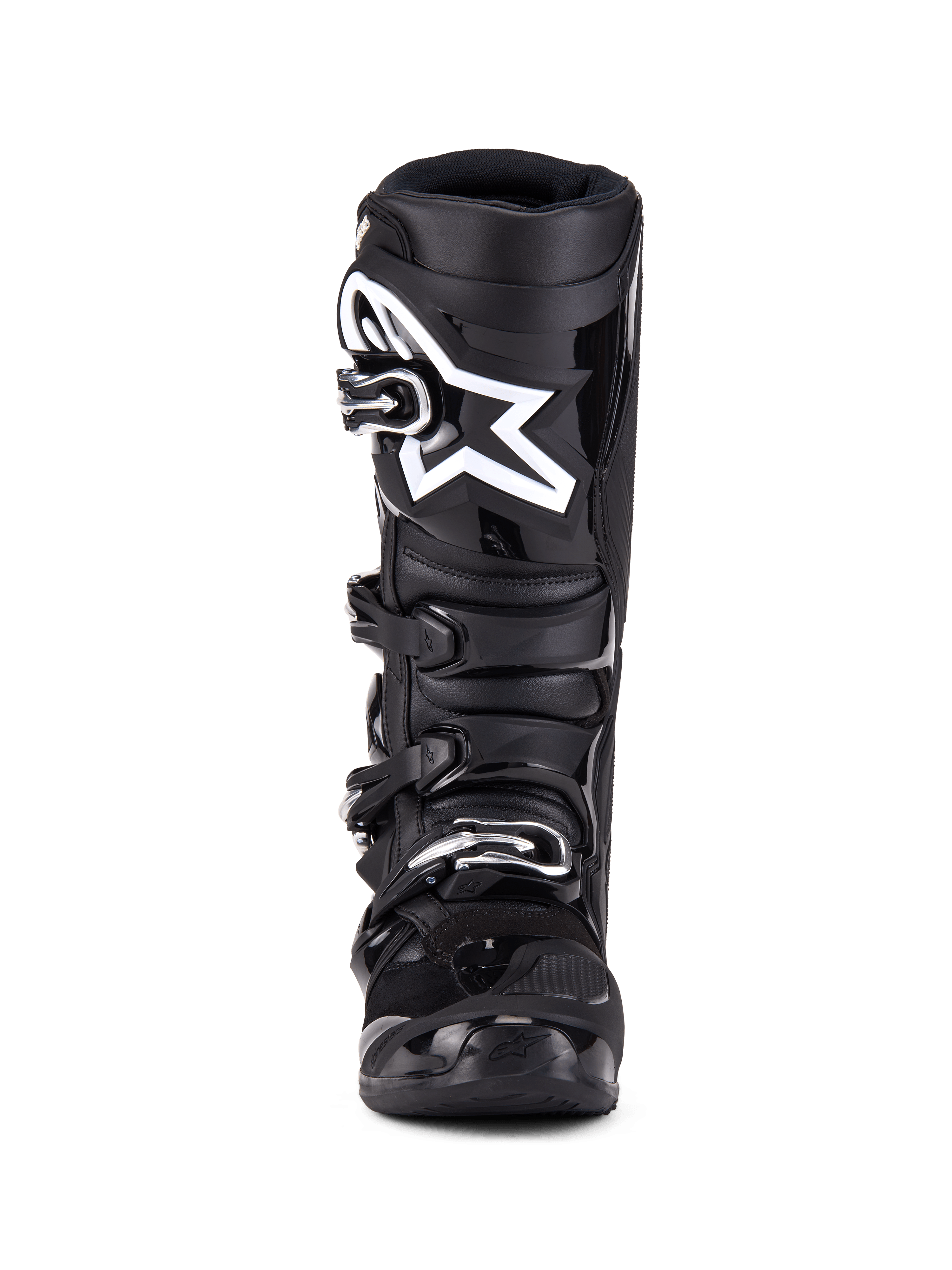 Botas Alpinestars Tech 7, botas de motocross, pretas, vista frontal com sistema de fecho de quatro fivelas, logótipo de estrela da Alpinestars proeminente a branco na placa da canela, estrutura em TPU durável e proteção reforçada para competições de todo-o-terreno.