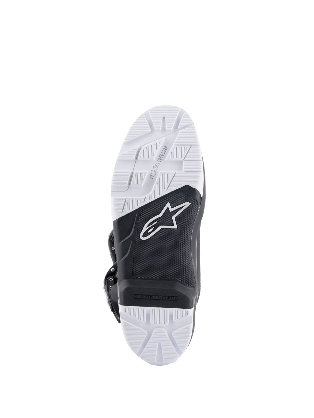 Botas Alpinestars Tech 7 Enduro, vista da sola mostrando a sola de composto especificamente projetada, design bicolor em preto e branco com padrões de aderência texturizados, logótipo da estrela branca e um inserto de apoio para os pés substituível.