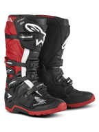 Alpinestars Honda Tech 7 Enduro Drystar® Boots, Enduro Motorcycle Boots, Black and Bright Red, three-quarter front view featuring a four-buckle closure system, protective shin plates, and high-grip red soles with prominent Honda and Alpinestars logos.