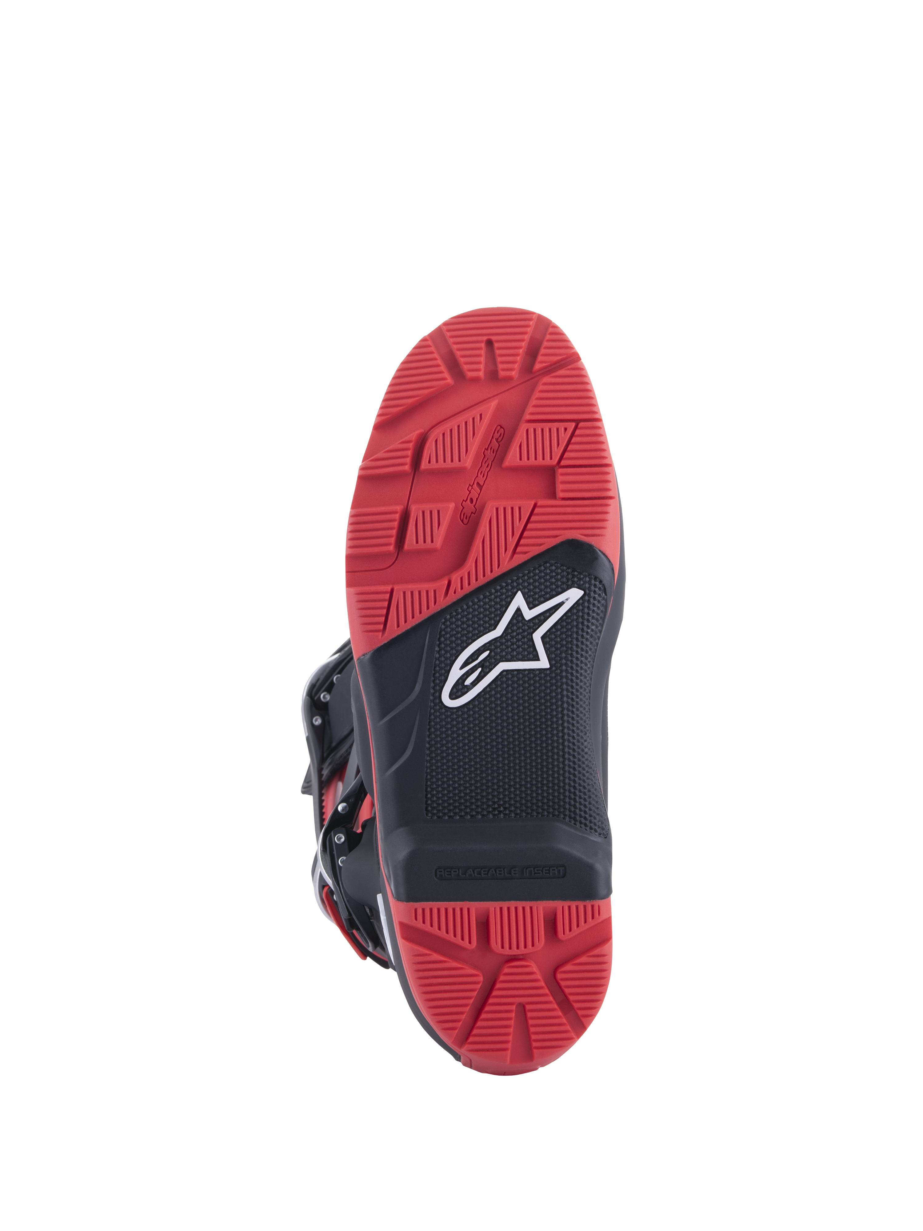 Honda Tech 7 Enduro Drystar® Boots, Black and Bright Red, sole view showing high-grip tread pattern with replaceable insert, dual-density rubber construction, and white Alpinestars logo on black textured panel.
