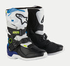 Alpinestars Kids Tech 3S Boots, Youth Motocross Boots, White Black and Enamel Blue, featuring white and black protective panels, blue accents on the heel and top, neon yellow branding, and a secure buckle closure system.