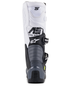 Botas Alpinestars Tech 5, botas de motocross, preto, cinzento escuro e branco, vista traseira mostrando a parte superior branca com marca Tech 5, zonas de flexão em acordeão cinzentas e proteção de calcanhar preta com logótipo Tech Series