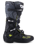 Botas Alpinestars Tech 5, botas de motocross e todo-o-terreno, vista lateral de perfil, pretas e cinzento 'cool' com detalhes em amarelo néon, padrão camuflado, fivelas ajustáveis e sola protetora robusta.