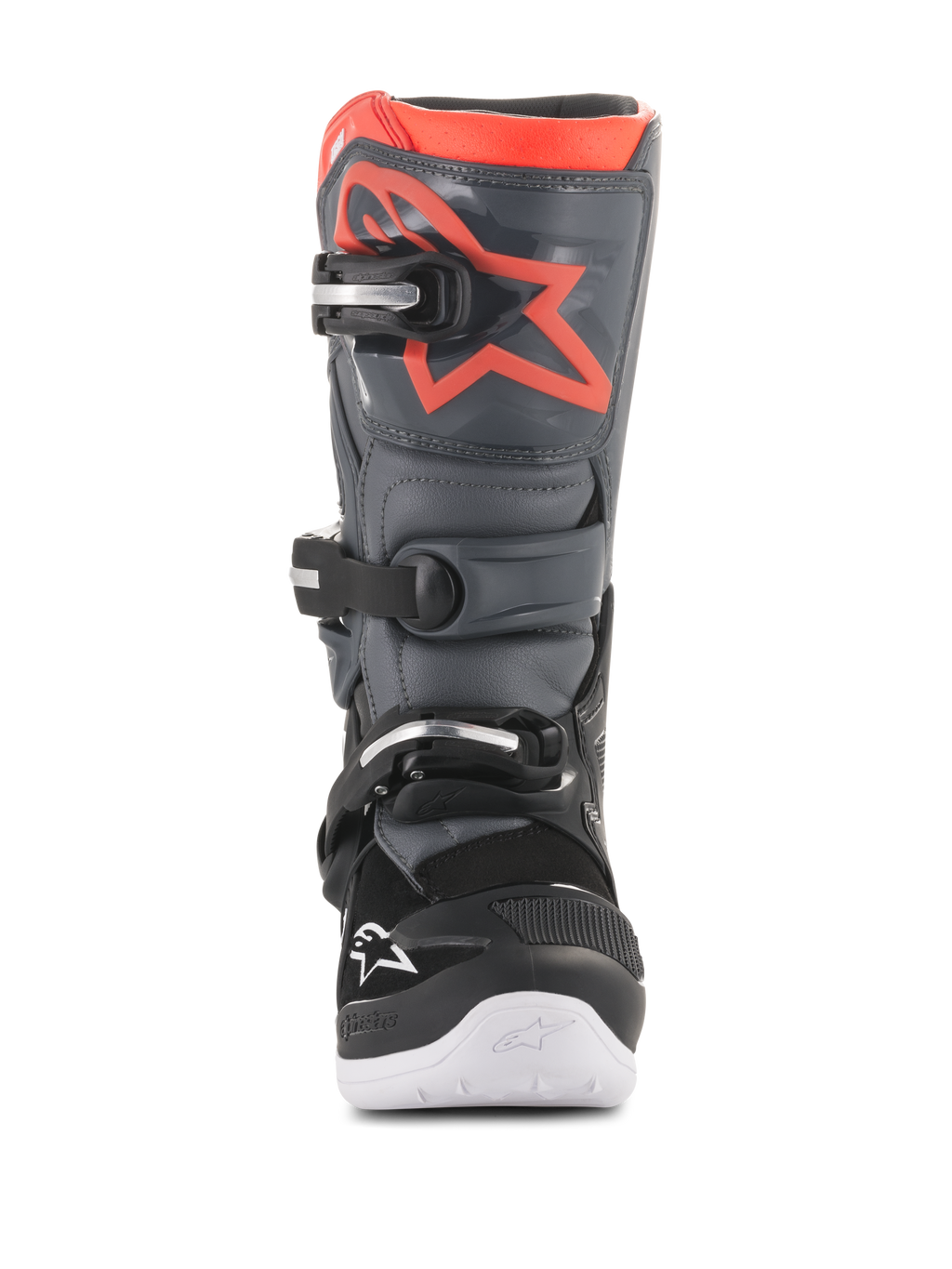 Botas Alpinestars Youth Tech 7S, botas de motocross, pretas e cinzento escuro com detalhes em vermelho fluorescente, vista frontal, com placa de canela em TPU com logótipo de estrela vermelha, sistema de fecho de três fivelas e sola integrada branca, equipamento de proteção durável para todo-o-terreno