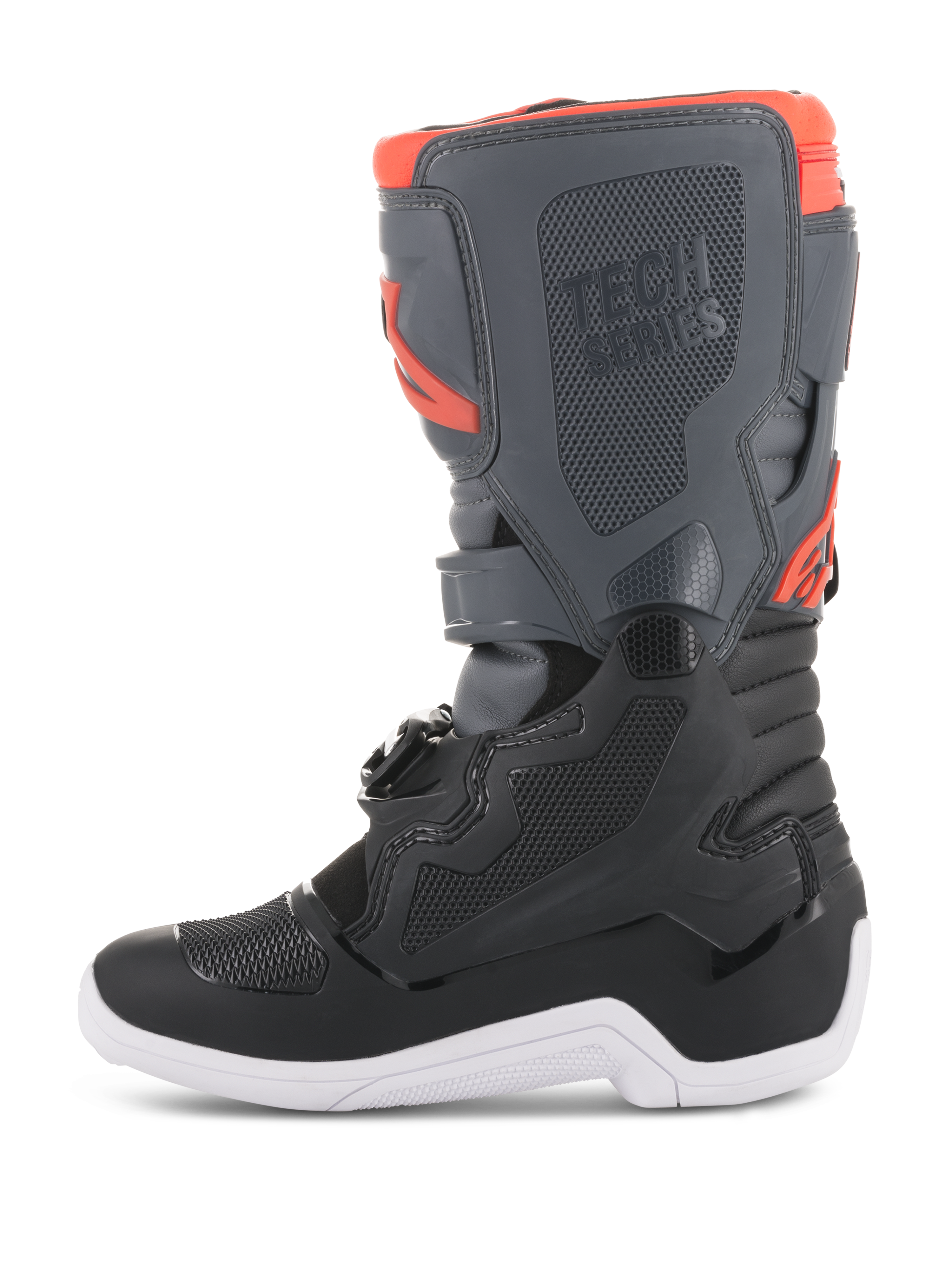 Botas Alpinestars Youth Tech 7S, botas de motocross, em preto, cinzento escuro e vermelho fluorescente, vista de perfil lateral com painéis protetores em TPU, marca Tech Series e sola branca