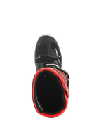 Botas Alpinestars Youth Tech 7S, botas de motocross, pretas e vermelho fluorescente, vista superior mostrando o forro interior vermelho, estrutura exterior preta com logótipo de estrela branco e construção sintética durável