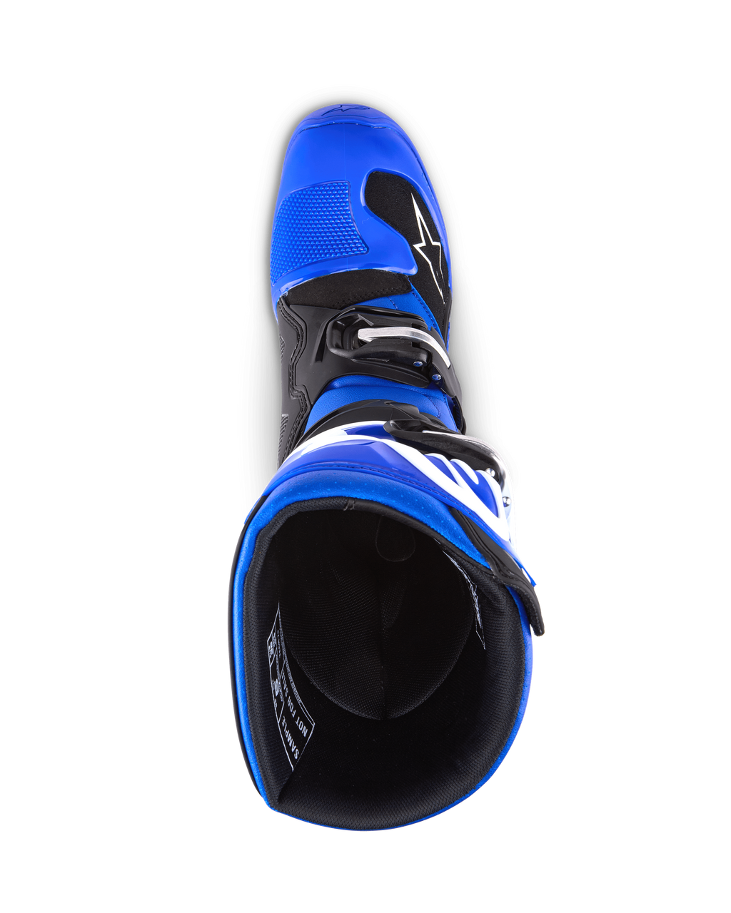 Botas Alpinestars Youth Tech 7 S, botas de motocross, azul, preto e branco, vista de cima para o interior da bota, mostrando a estrutura exterior azul e o forro preto, construção durável com logótipo branco para corridas de motocross juvenis