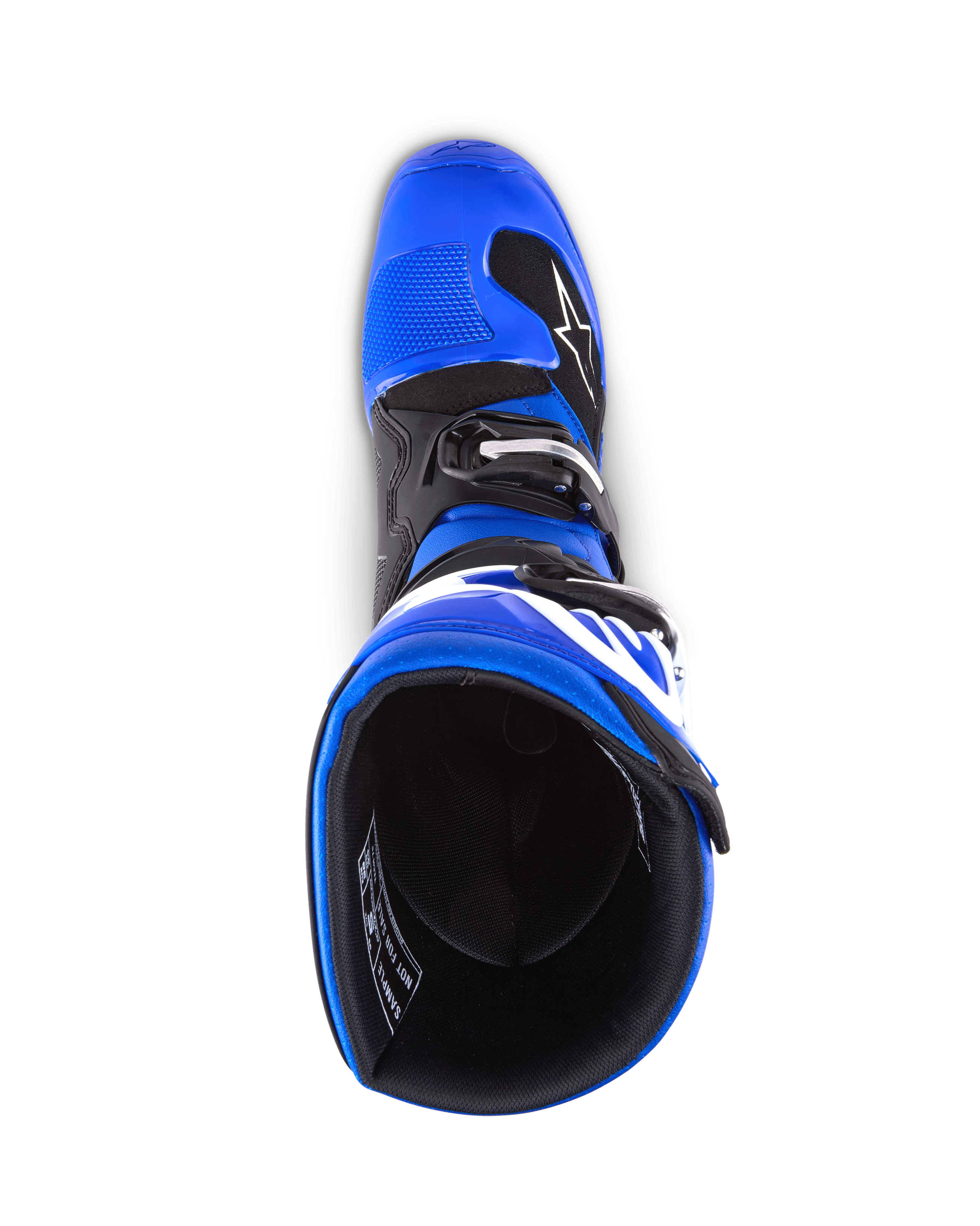 Botas Alpinestars Youth Tech 7 S, botas de motocross, azul, preto e branco, vista de cima para o interior da bota, mostrando a estrutura exterior azul e o forro preto, construção durável com logótipo branco para corridas de motocross juvenis