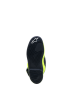 Alpinestars Tech 7S Jovem, sola de bota de motocross em preto e amarelo fluo com borracha de alta aderência.
