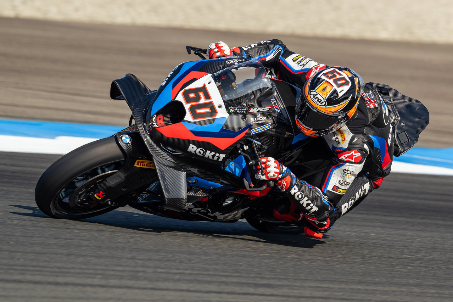 Michael van der mark leaning his Superbike BMW wearing Alpinestars protections