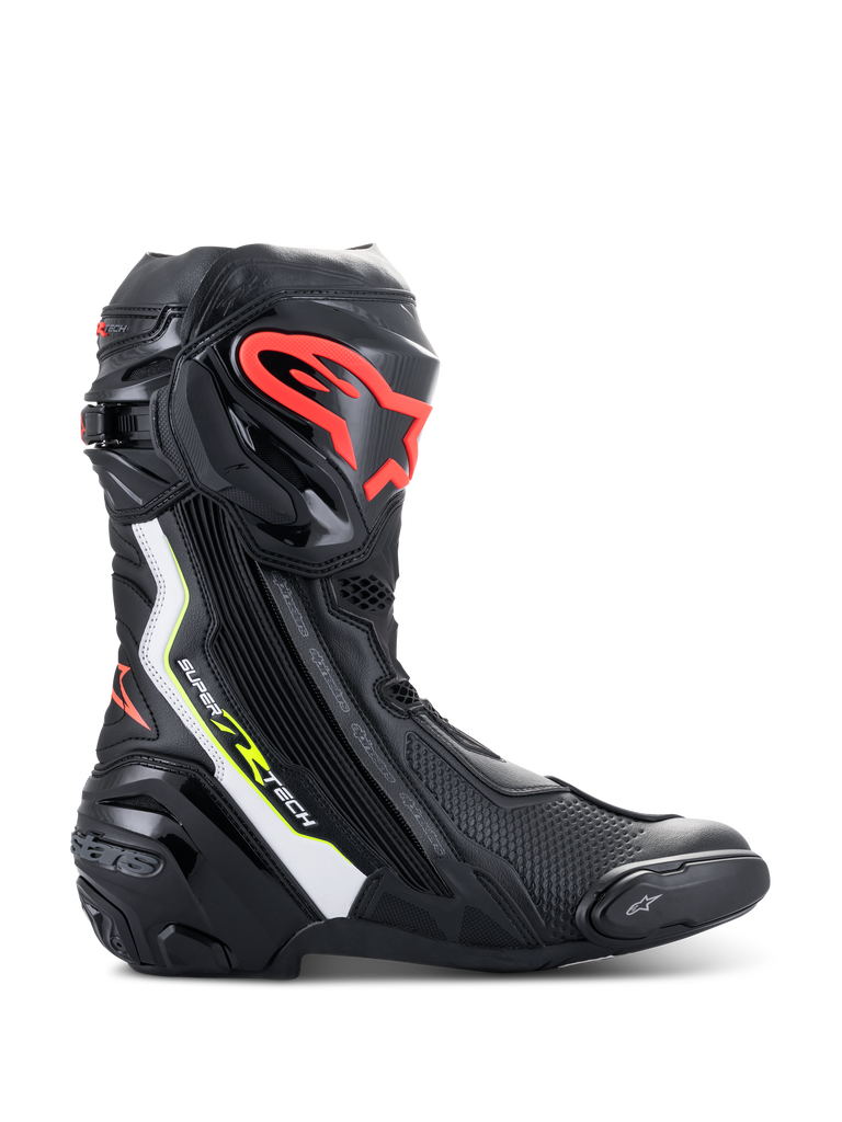 Alpinestars Supertech R Boots, high-performance motorcycle racing boots in black with white, red fluo, and yellow fluo accents, featuring a protective TPU shin plate with a red logo, replaceable toe slider, and sleek aerodynamic profile.
