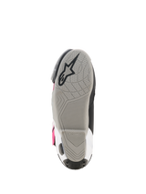 Alpinestars Supertech R Boots, bottom view of the sole, light gray rubber compound with integrated grip tread pattern, black Alpinestars star logo, visible white and magenta accents, high-performance racing footwear.