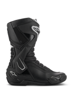 Botas Alpinestars SMX-6 V3, botas de motociclismo de alta performance, pretas com detalhes brancos, vista lateral com sistema de proteção de tornozelo em TPU, zonas de flexão em malha texturizada, componentes reforçados no calcanhar e biqueira para desempenho em pista e estrada