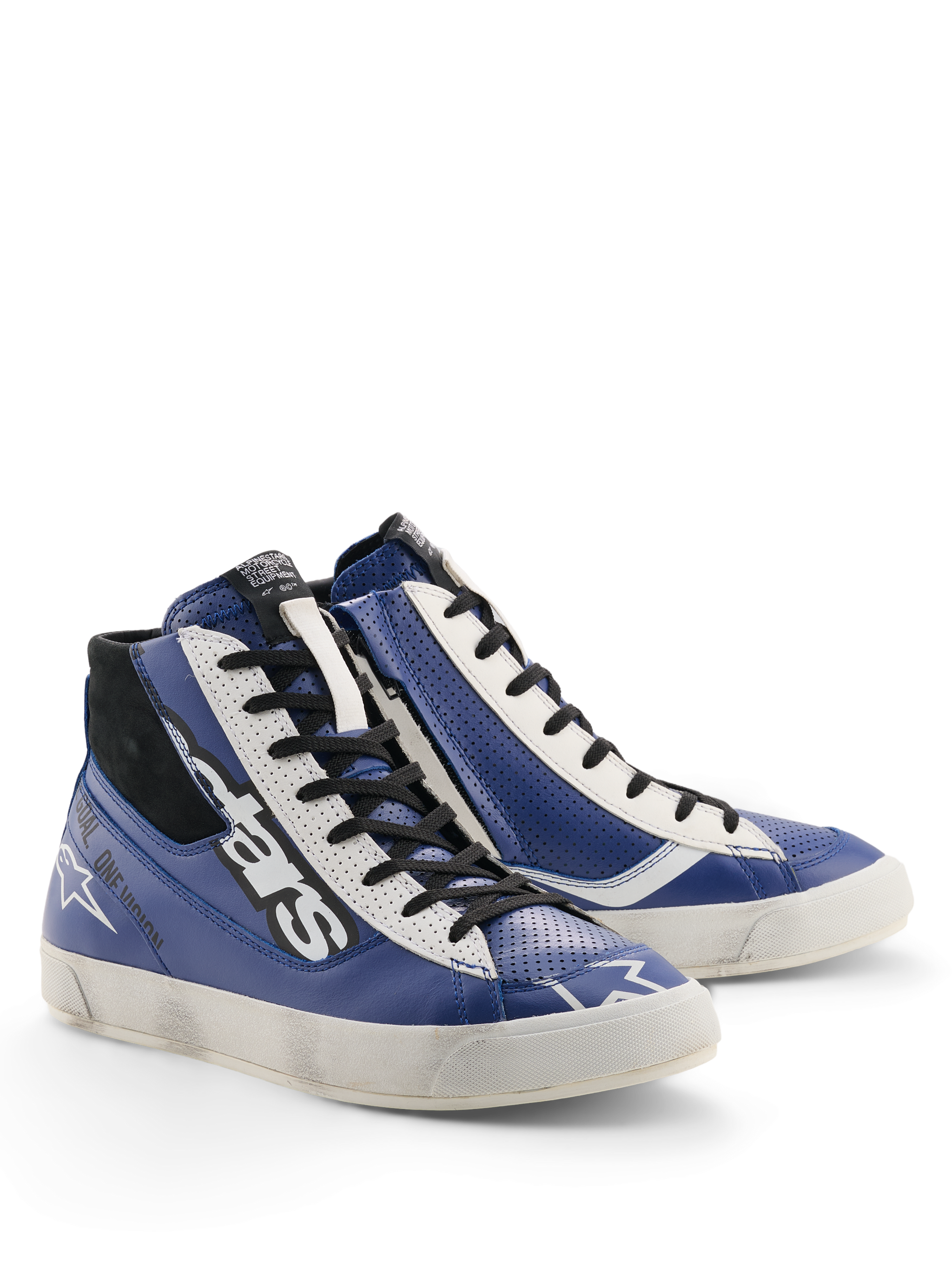 Sapatos Alpinestars Stated Flair, sapatos de motociclismo urbanos, azul brilhante, branco e preto, estética racing clássica com efeito de desgaste aplicado à mão na sola, construção em pele premium com detalhes perfurados e fecho lateral.
