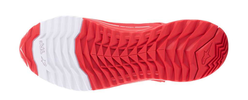 Alpinestars MM93 CR-X Drystar® Riding Shoes, Outsole View, Bright Red and White, featuring an asymmetric stud configuration for grip, white heel section with Alpinestars star logo, oil-resistant dual rubber compound for stability and walking comfort