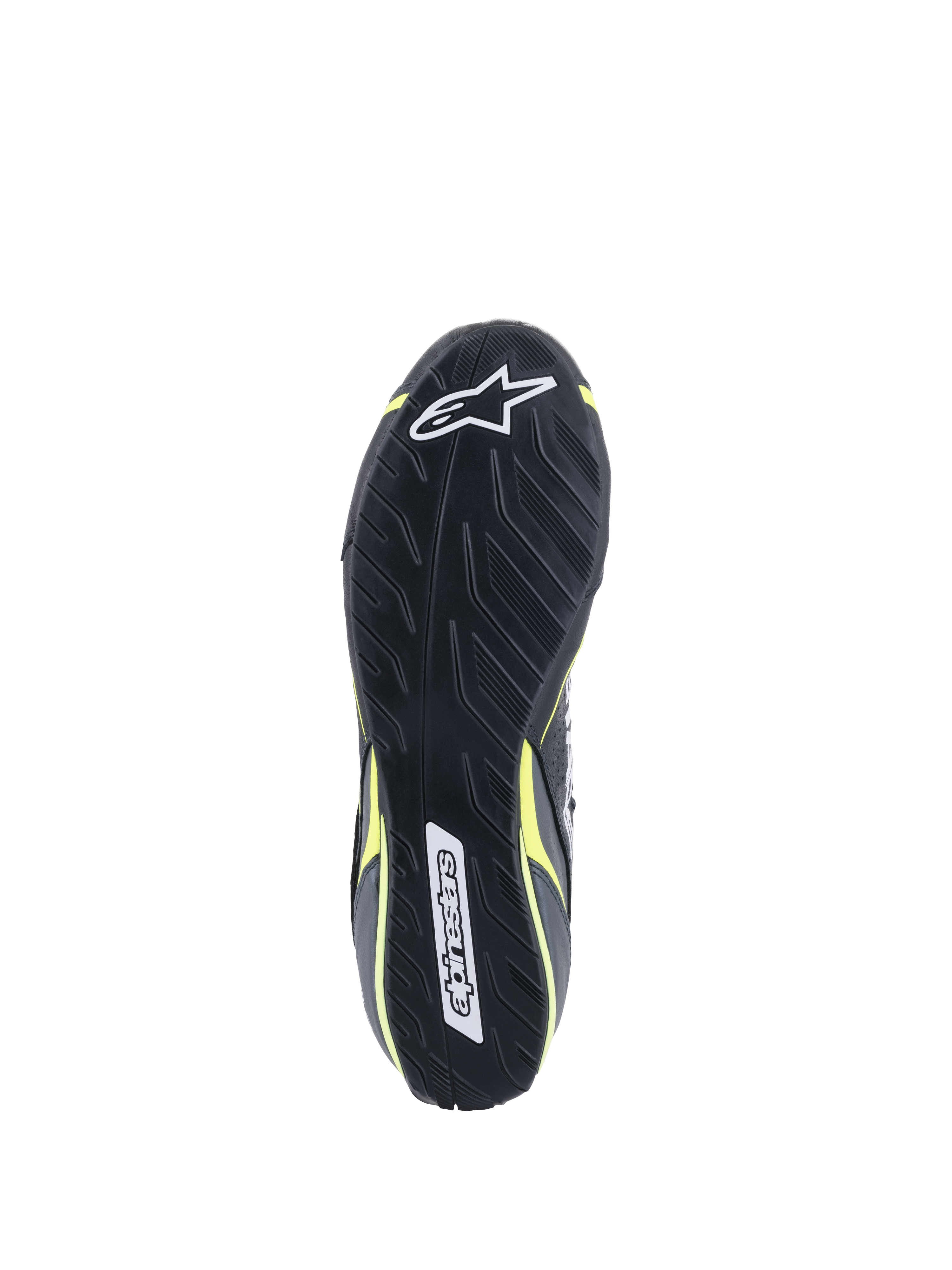 Sapatos Alpinestars Tech-1 T V3 FIA, vista da sola, pretos com detalhes em amarelo néon, sola de borracha inspirada no padrão de rasto de pneus assimétrico, com logótipos Alpinestars e padrão texturizado para sensibilidade nos pedais e aderência