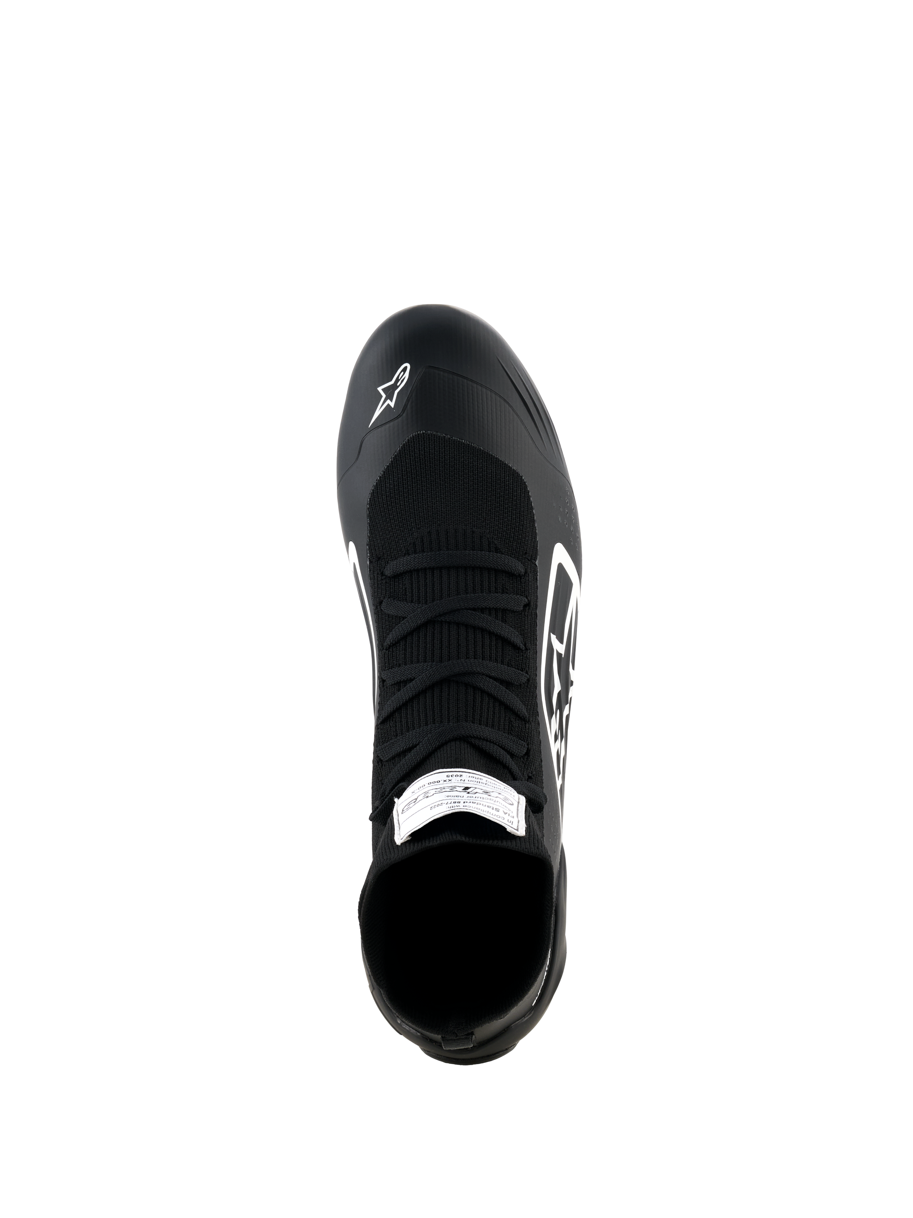Alpinestars Supertech K Shoes, sapatos de karting, pretos e brancos, vista superior com parte superior totalmente tricotada, atacadores pretos, logótipo Alpinestars branco na biqueira e etiqueta de certificação FIA na língua
