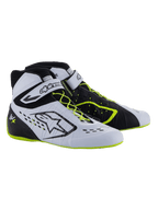 Sapatos Alpinestars Tech-1 KX V3 - FIA, sapatos de karting, pretos, brancos e amarelo néon, calçado de corrida de alta performance com atacadores assimétricos, tira de velcro no tornozelo, detalhes em amarelo néon nos atacadores e na sola, e painéis respiráveis cortados a laser