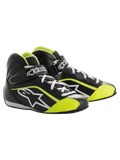 Alpinestars Youth Tech-1 K, sapatos de corrida de karting para jovens, pretos e amarelo fluorescente, design de cano alto com atacadores brancos, tira de velcro com a marca, logótipo de estrela lateral e painéis perfurados.