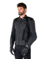 Alpinestars Missile V3 Airflow Leather Jacket, Black Black, worn by a man with black motorcycle gloves and pants, featuring extensive perforated leather panels, DFS shoulder protectors, and a sleek race-fit design.