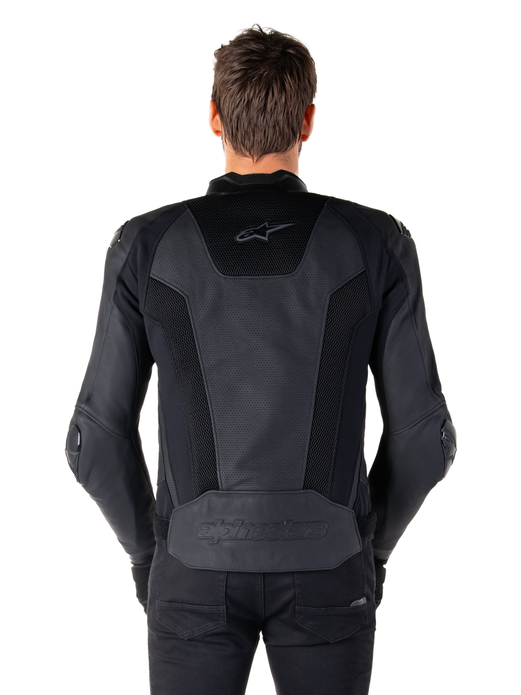 Rear view of a model wearing the Alpinestars Missile V3 Airflow Leather Jacket in Black, showing extensive perforated panels and mesh inserts on the back for ventilation, with embossed branding on the lower back.