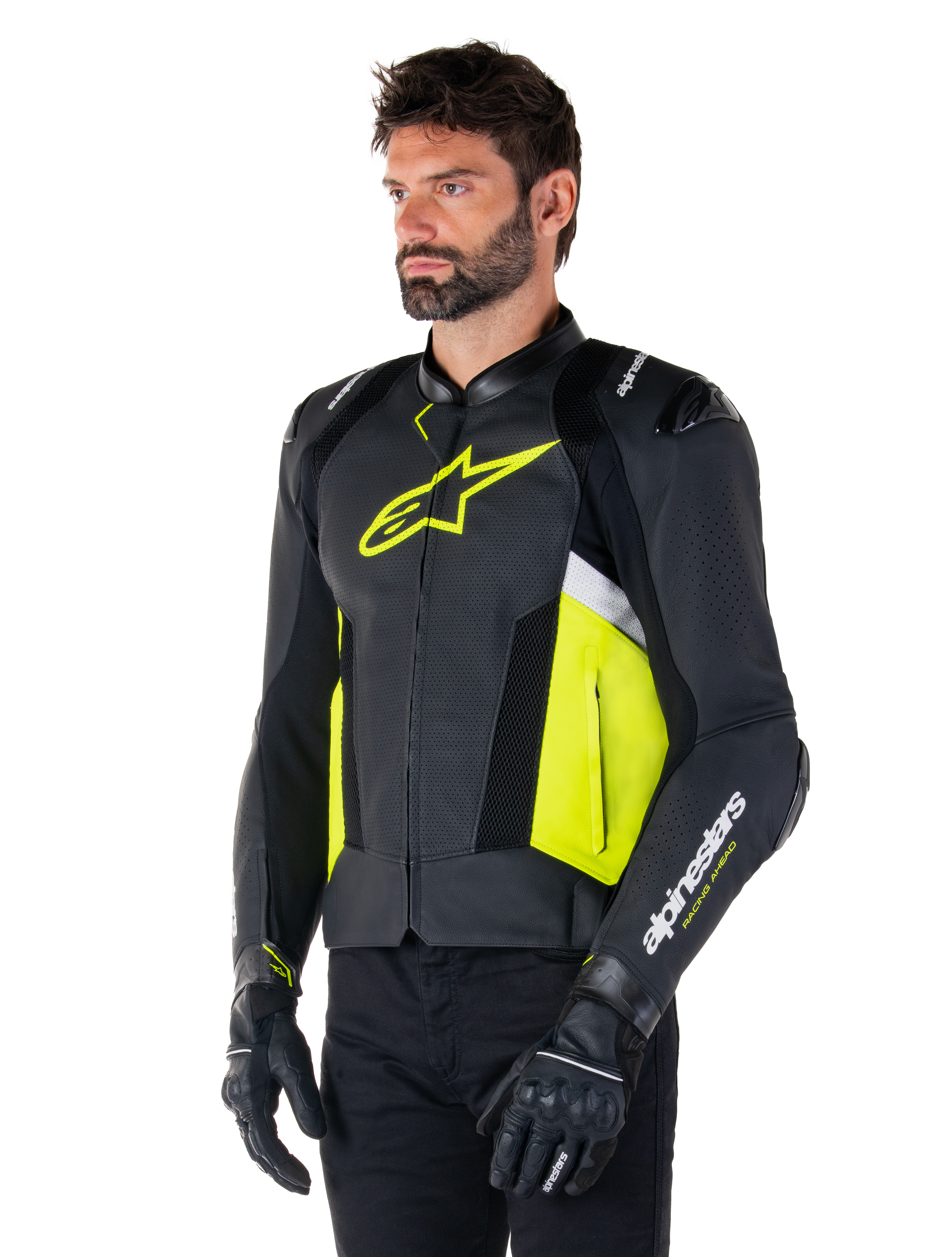 Male model wearing Alpinestars Missile V3 Airflow Leather Jacket, Black with Yellow Fluo and White accents, featuring perforated leather for maximum ventilation, bold yellow logo on the chest, paired with black gloves and pants, sport-style racing motorcycle gear