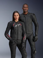 Alpinestars Dusk Airflow and Stella Dusk Leather Jackets, male and female riders wearing black leather motorcycle jackets, men's jacket featuring perforated leather for ventilation, women's jacket with red accents and white logos, coordinated with black riding pants and gloves, performance sport riding apparel
