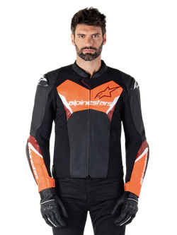 Alpinestars Faster V3 Leather Jacket, Sport Motorcycle Jacket, Black and Red Fluo, worn by a male model with black riding gloves and pants, featuring bold Alpinestars branding on chest and forearms, premium leather construction for road riding.