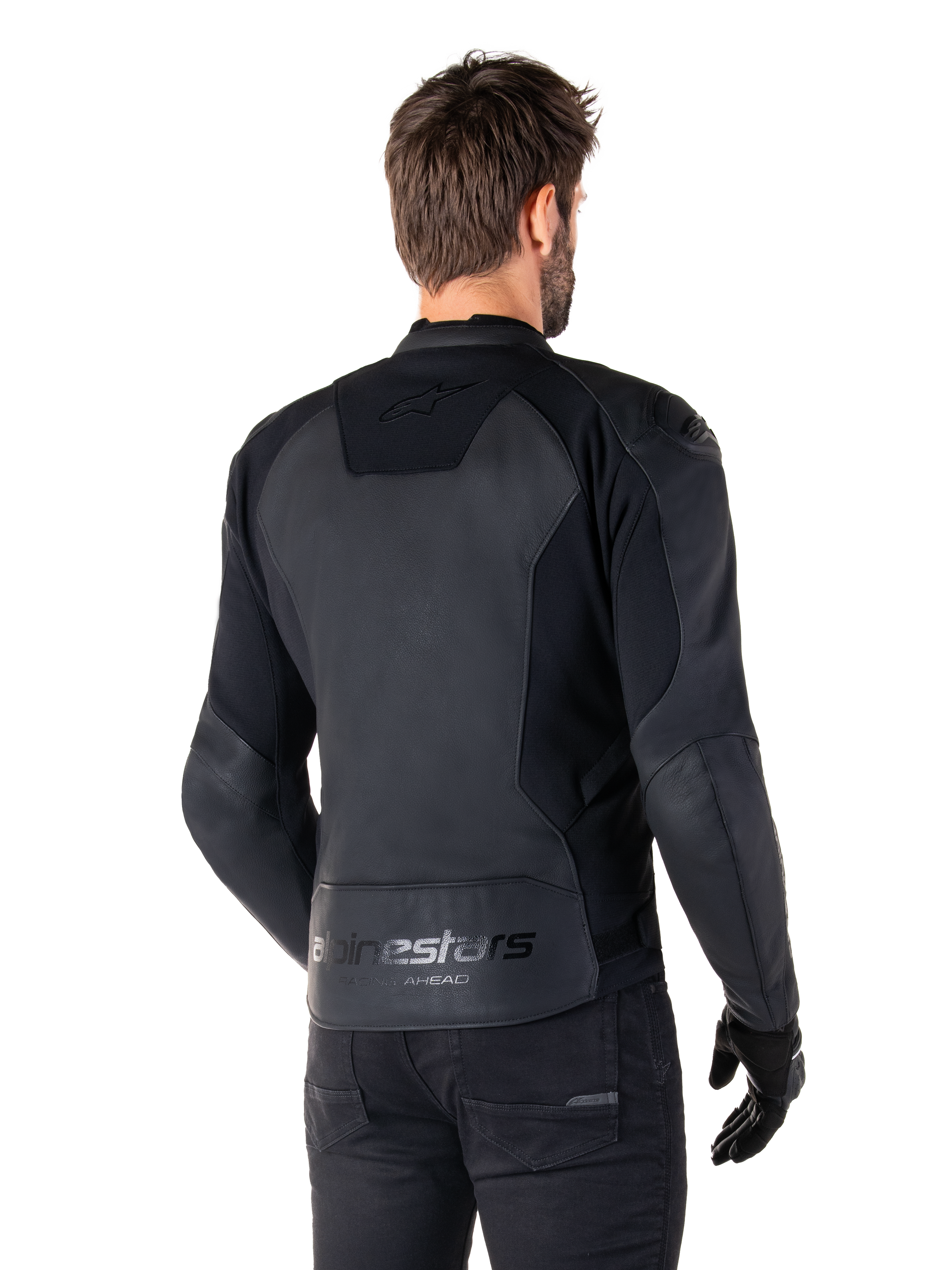Alpinestars Faster V3 Leather Jacket, Black Black, Rear view of model wearing the sport riding jacket, featuring 'alpinestars' and 'RACING AHEAD' branding on the lower back, premium leather with matte panels, modern sport silhouette for motorcycle riding