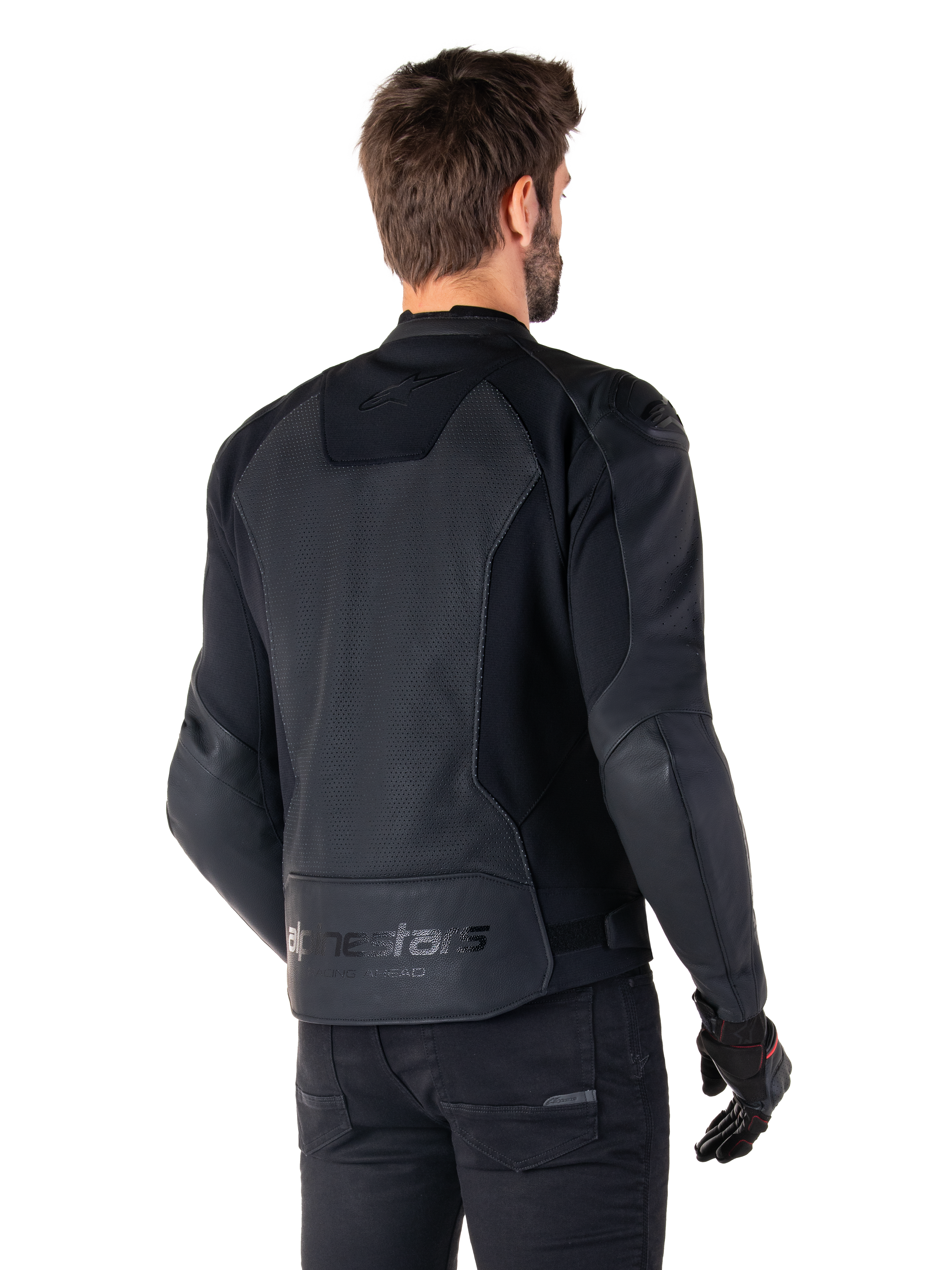 Alpinestars Faster V3 Airflow Leather Jacket, Black, Rear view of a man wearing a sport leather motorcycle jacket, featuring perforated back panels, stretch inserts, and Alpinestars branding on the lower hem, paired with black pants and gloves