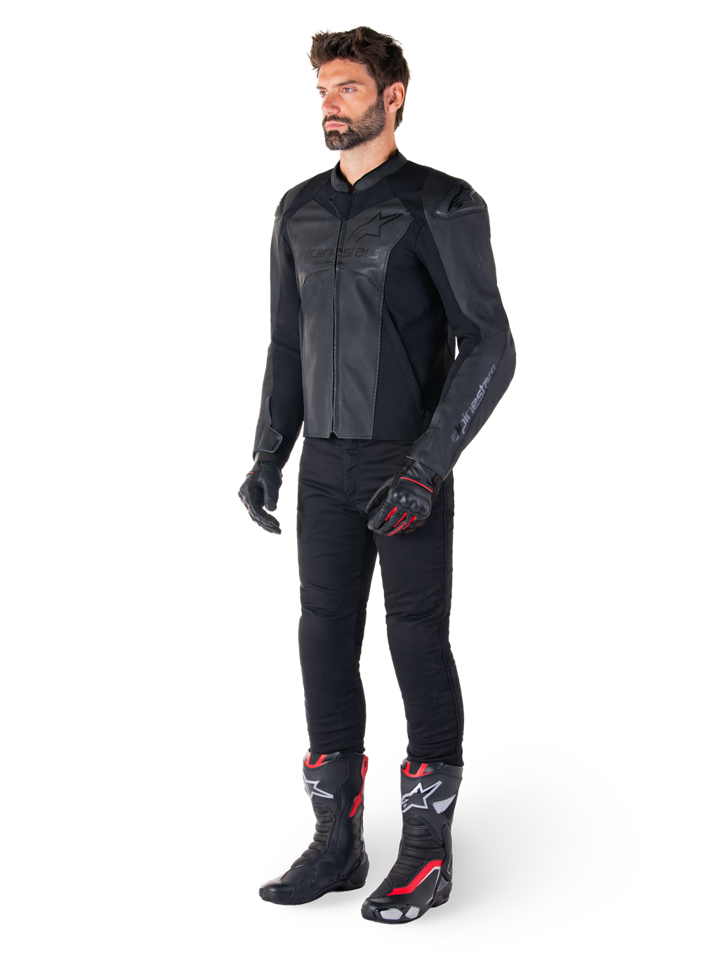 Man wearing Alpinestars Faster V3 Airflow Leather Jacket in Black Black, paired with black pants, black and red motorcycle gloves, and black racing boots with red and white accents, full-body sport riding gear