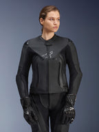 Alpinestars Stella GP Plus V4 Leather Jacket, Black, Women's Motorcycle Racing Jacket, premium leather construction with protective padding, sleek design with subtle logo, worn by a female model with matching black gear