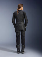 Alpinestars Women Stella GP Plus V4 Leather Jacket, Black Black, full-body rear view of a female rider wearing matching leather pants and boots, sleek minimalist design with a small red logo on the neck, tailored sport silhouette for women