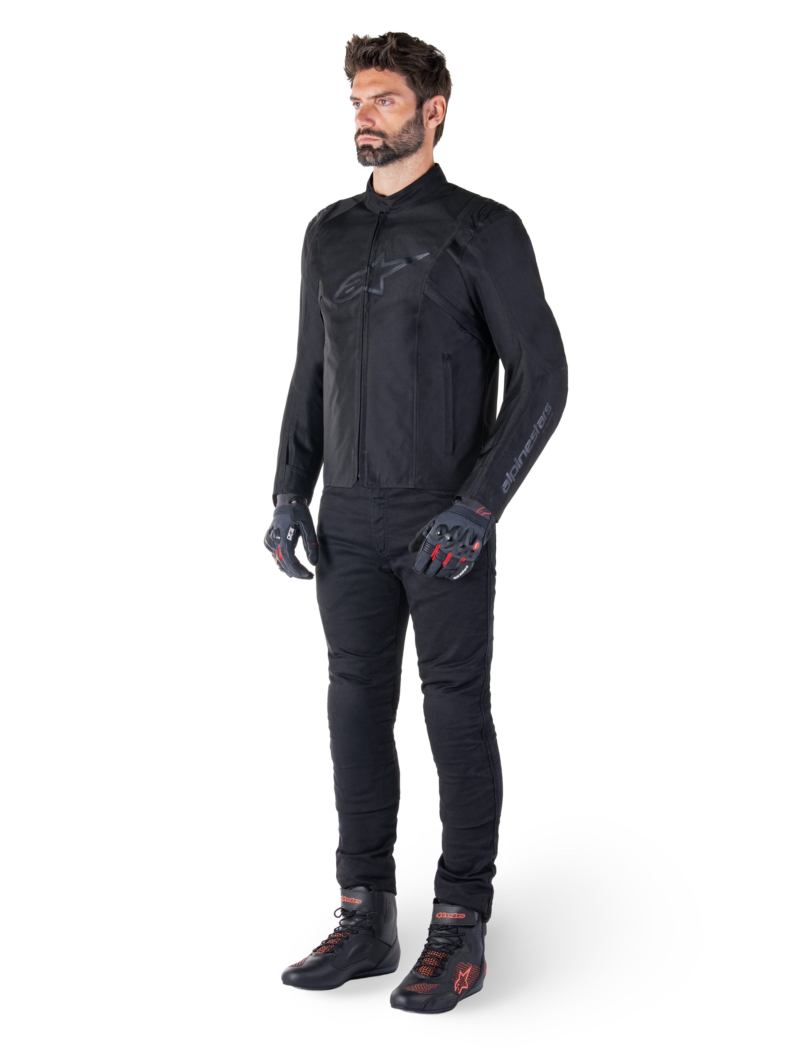 Alpinestars T-SPS V2 Waterproof Jacket, Black, worn by a male model with matching black pants, black gloves with red accents, and black riding shoes, full motorcycle gear for urban and sport riding, clean white background