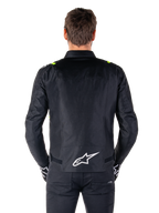 Alpinestars T-SPS V2 Waterproof Jacket, vista traseira, preto com detalhes em amarelo fluo nos ombros e logótipo de estrela branco na parte inferior das costas, casaco de motociclismo têxtil com silhueta desportiva, usado por modelo masculino