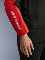 Alpinestars T-SPS V2 Waterproof Jacket, Motorcycle Jacket, Black and Red, close-up of the sleeve featuring a white vertical brand logo on a red panel, durable textile construction with a sport-inspired design.