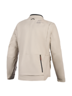 Casaco Alpinestars Borrego Drystar®, casaco de motociclismo, cinzento Warm Gray, vista traseira com um grande compartimento traseiro com fecho de correr, construção em lona têxtil durável com logótipo Alpinestars no ombro, design pronto para a aventura
