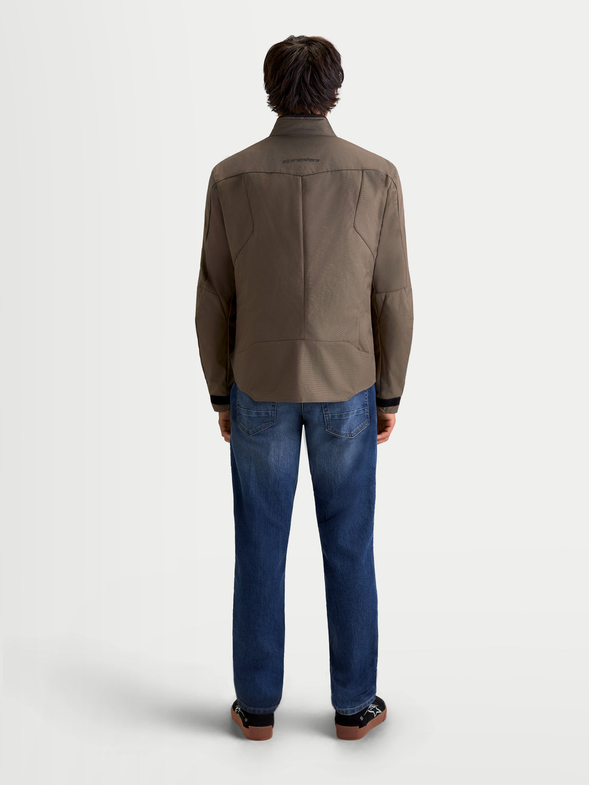 Alpinestars C-1 Waterproof Jacket, men's urban contemporary motorcycle textile jacket in walnut black, rear view on a model wearing jeans, showing 450D polyfabric construction and 3D back pattern