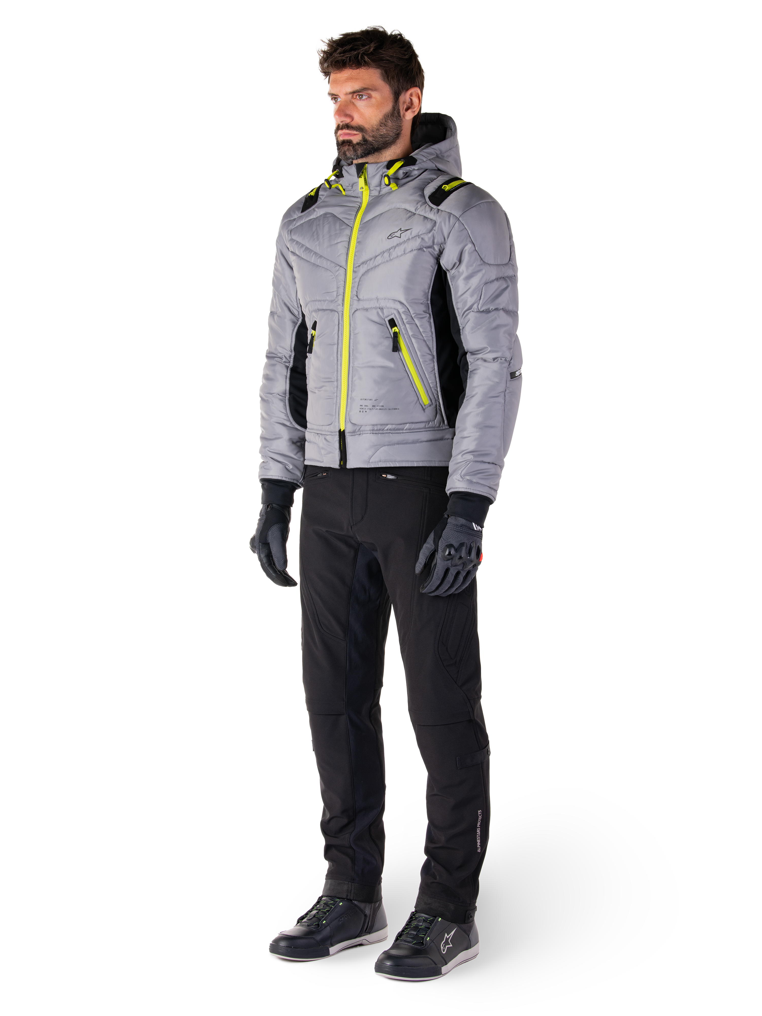 Alpinestars Mohobbs Waterproof Jacket in Lunar Gray and Lime Punch, quilted bomber-style motorcycle jacket with neon accents, worn by model with black riding pants and gloves, urban streetwear-inspired protective gear