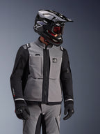 Alpinestars Andes Pro Drystar® XF Jacket, Dark Gray and Black, adventure motorcycle jacket worn with black SM10 helmet and matching riding gear, 3-layer textile design with central zipper and chest pockets, articulated design for all-weather touring