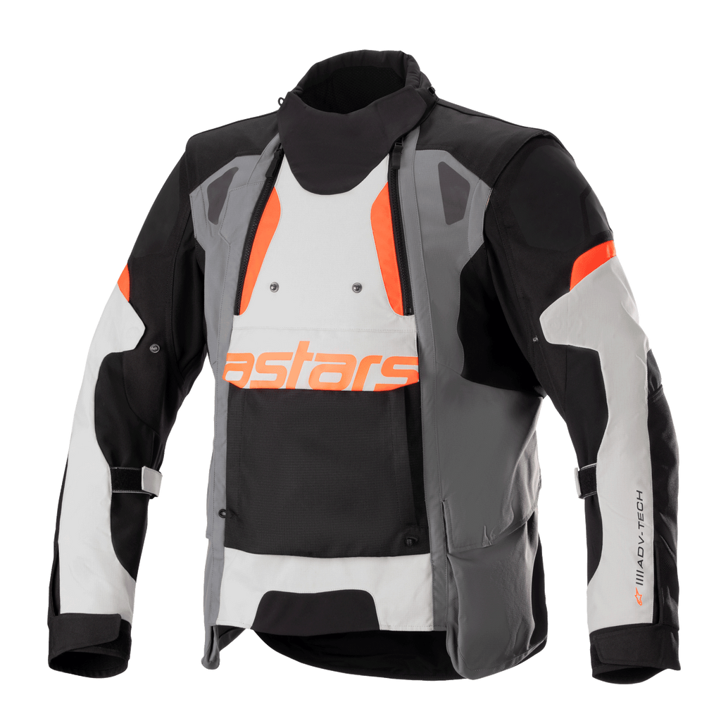 Alpinestars Halo Drystar® Jacket, Motorcycle Adventure Touring Jacket, Dark Gray, Ice Gray, and Black with Orange accents, featuring an asymmetric front ventilation panel, orange astars branding, adjustable sleeve straps, and high collar, protective textile gear for all-season adventure riding