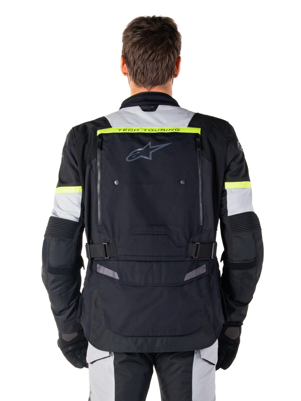 Alpinestars Bogota' Pro Drystar® Jacket, casaco de motociclismo adventure touring, preto, cinzento e amarelo néon, vista traseira mostrando a marca 'TECH TOURING' numa faixa amarela fluorescente, grande painel de ventilação traseiro e tiras de ajuste na cintura, equipamento técnico para todas as estações